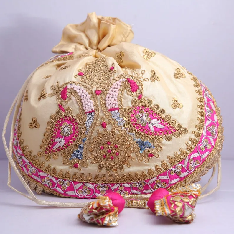 Cream colored embroidered Potli - Rent