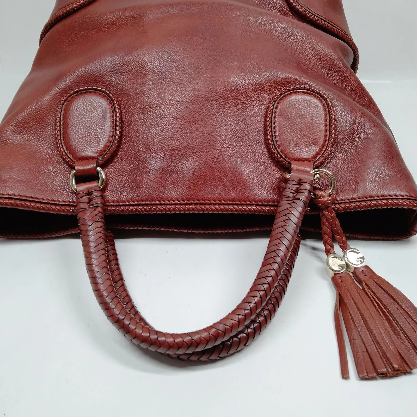 Gucci, Marrakech burgundy/ox blood leather, XL tote with gold GG accents, tassels and beautiful handwoven trim around the edges and handles